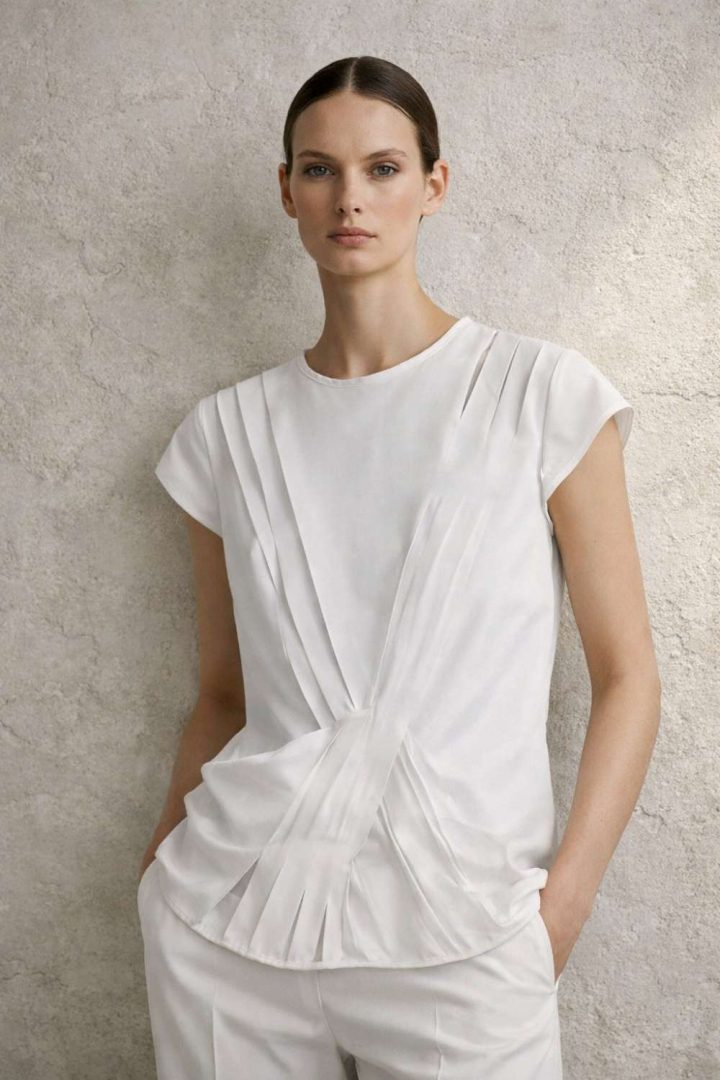 White symetrical cuts blouse